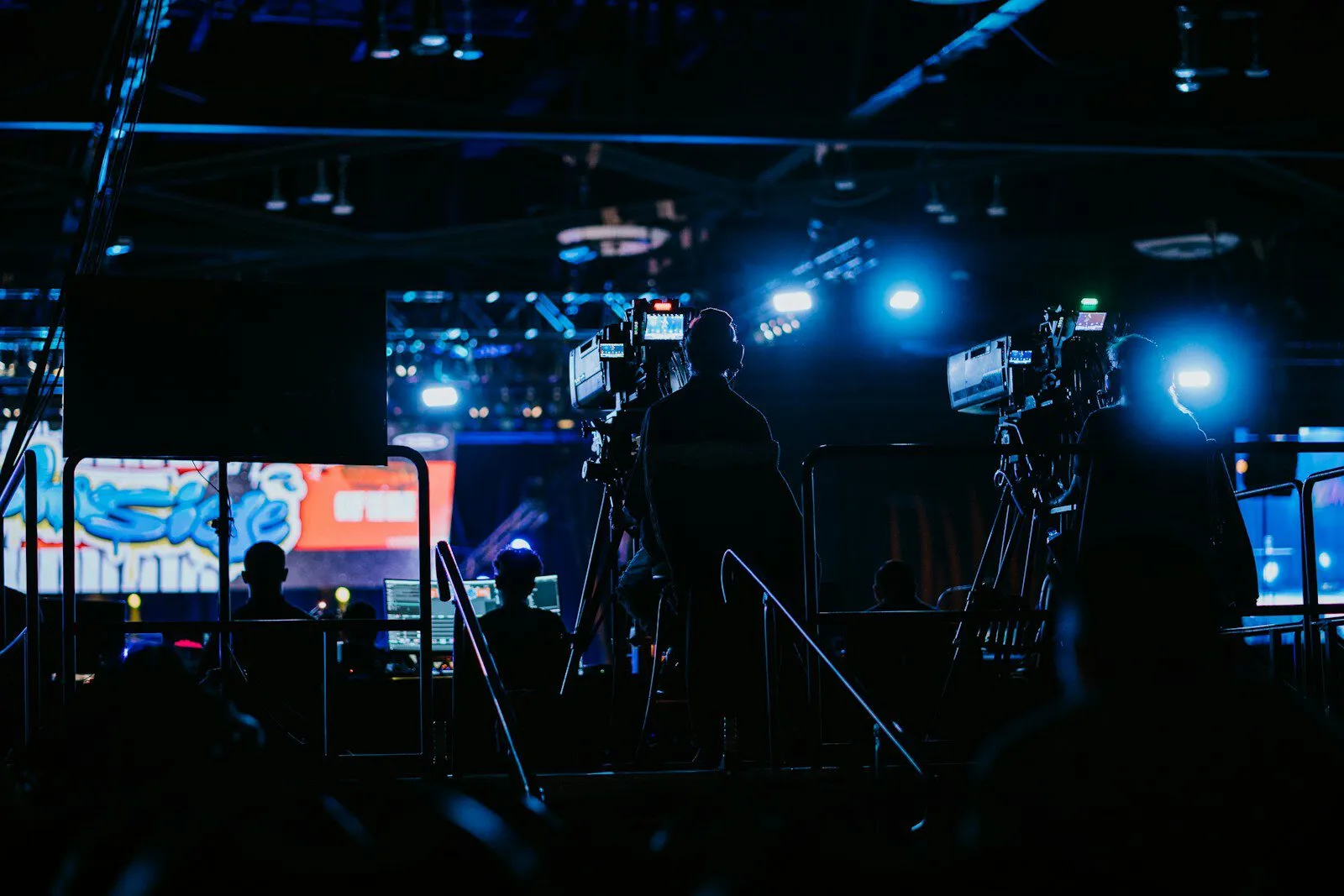 a group of people standing in front of a camera